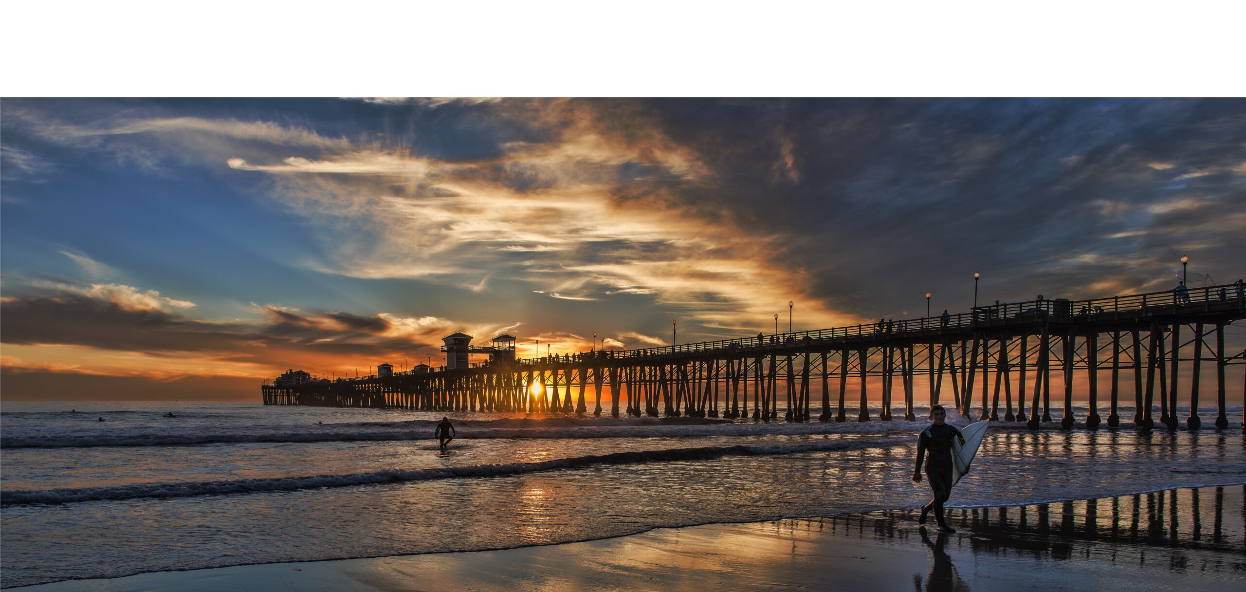 Pier Sunset Surfers